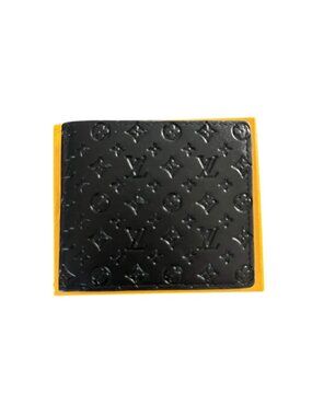 Louis Vuitton Embossed Monogram Bifold Wallet - Authentic